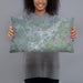 Person holding 20x12 Custom San Marcos Texas Map Throw Pillow in Afternoon