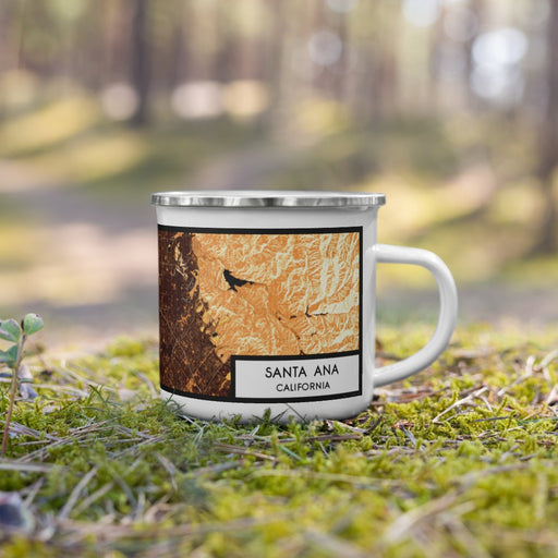 Right View Custom Santa Ana California Map Enamel Mug in Ember on Grass With Trees in Background