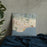 Custom Santa Barbara California Map Throw Pillow in Woodblock on Bedding Against Wall
