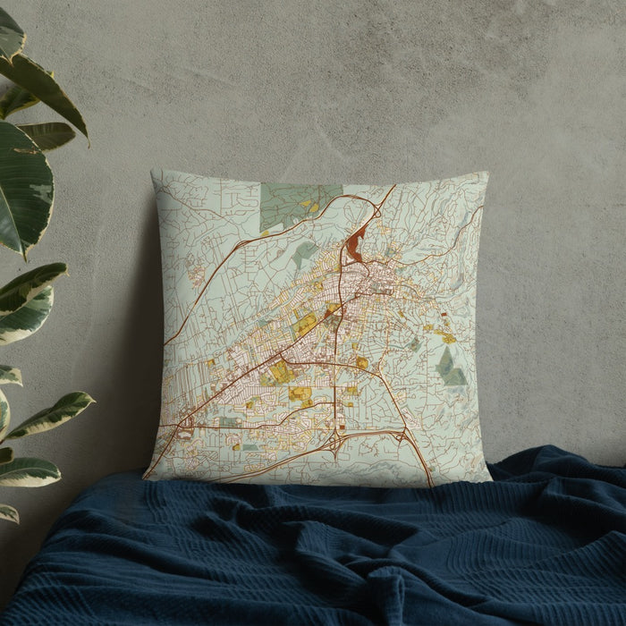 Custom Santa Fe New Mexico Map Throw Pillow in Woodblock on Bedding Against Wall