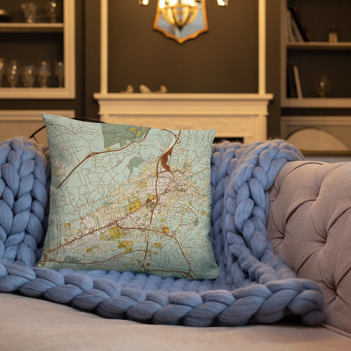 Custom Santa Fe New Mexico Map Throw Pillow in Woodblock on Cream Colored Couch