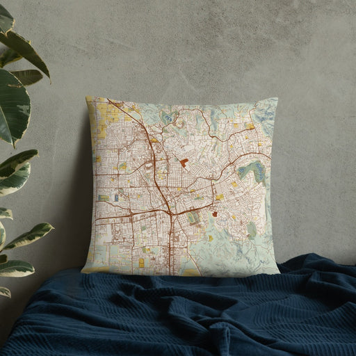 Custom Santa Rosa California Map Throw Pillow in Woodblock on Bedding Against Wall
