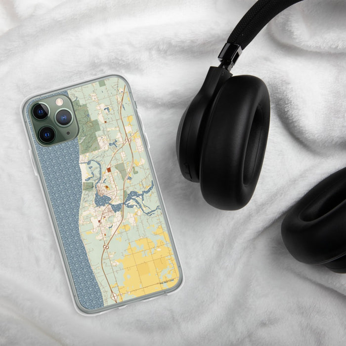 Custom Saugatuck Michigan Map Phone Case in Woodblock on Table with Black Headphones
