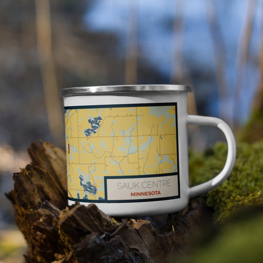 Right View Custom Sauk Centre Minnesota Map Enamel Mug in Woodblock on Grass With Trees in Background