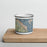 Front View Custom Sausalito California Map Enamel Mug in Woodblock on Cutting Board