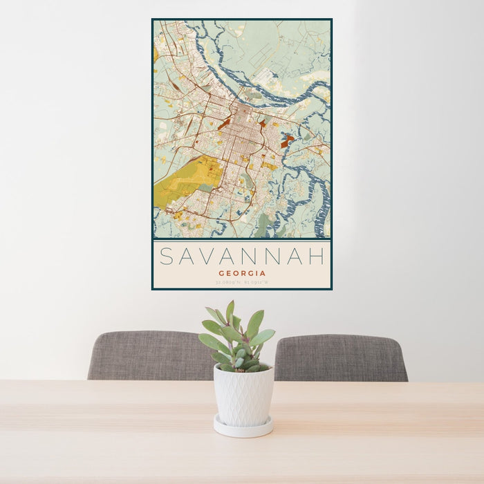 24x36 Savannah Georgia Map Print Portrait Orientation in Woodblock Style Behind 2 Chairs Table and Potted Plant