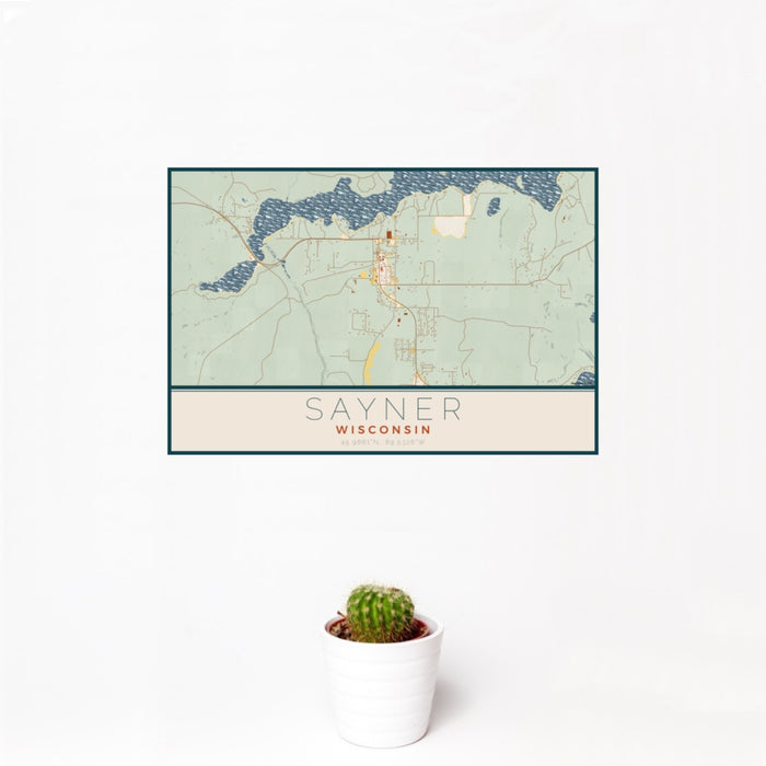 12x18 Sayner Wisconsin Map Print Landscape Orientation in Woodblock Style With Small Cactus Plant in White Planter