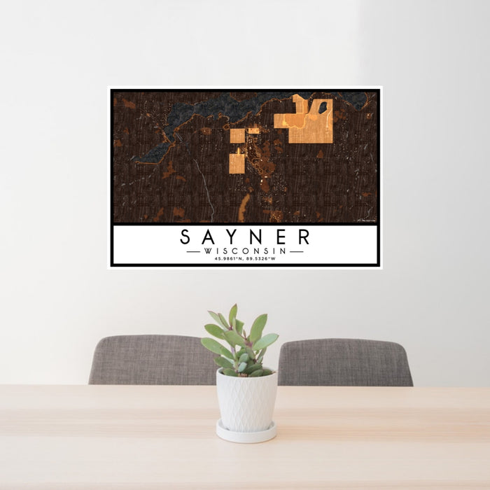 24x36 Sayner Wisconsin Map Print Lanscape Orientation in Ember Style Behind 2 Chairs Table and Potted Plant