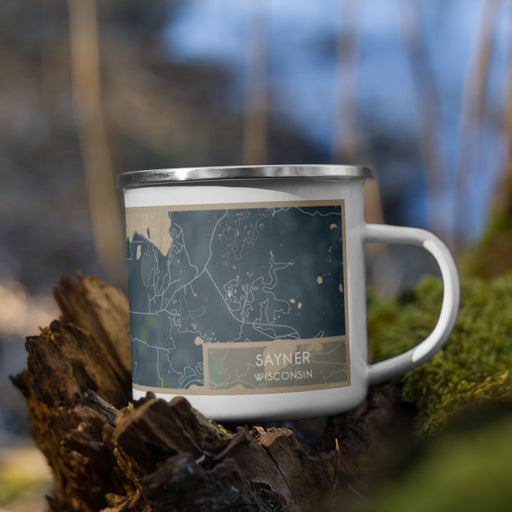 Right View Custom Sayner Wisconsin Map Enamel Mug in Afternoon on Grass With Trees in Background