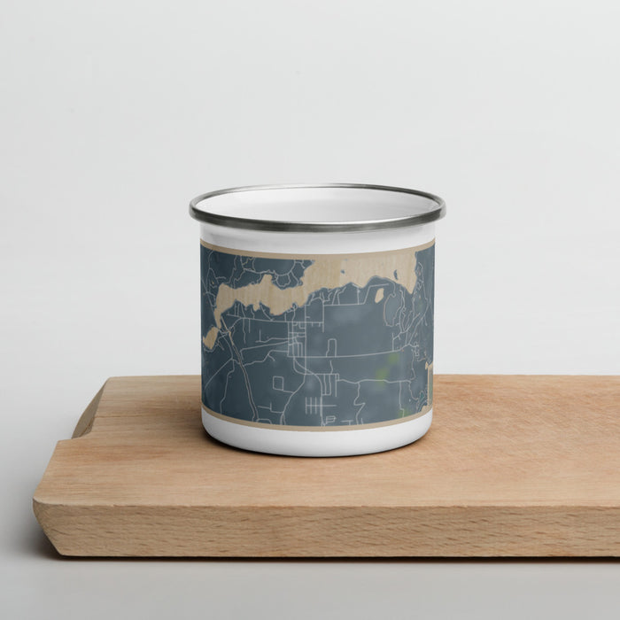 Front View Custom Sayner Wisconsin Map Enamel Mug in Afternoon on Cutting Board