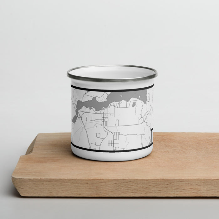 Front View Custom Sayner Wisconsin Map Enamel Mug in Classic on Cutting Board