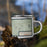 Right View Custom Searchlight Nevada Map Enamel Mug in Woodblock on Grass With Trees in Background