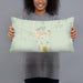 Person holding 20x12 Custom Searchlight Nevada Map Throw Pillow in Woodblock