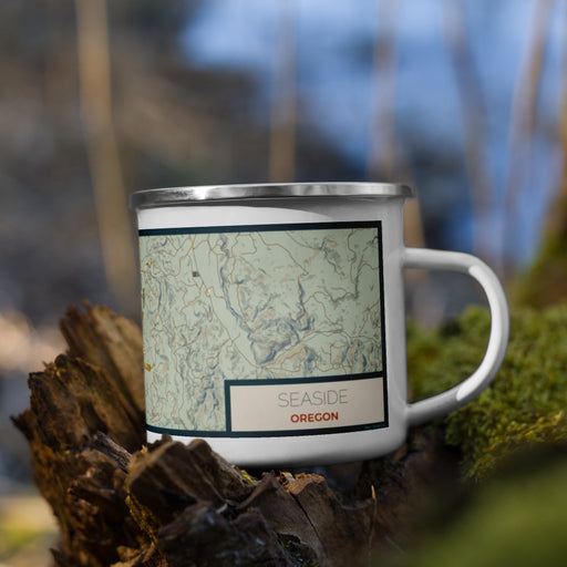 Right View Custom Seaside Oregon Map Enamel Mug in Woodblock on Grass With Trees in Background