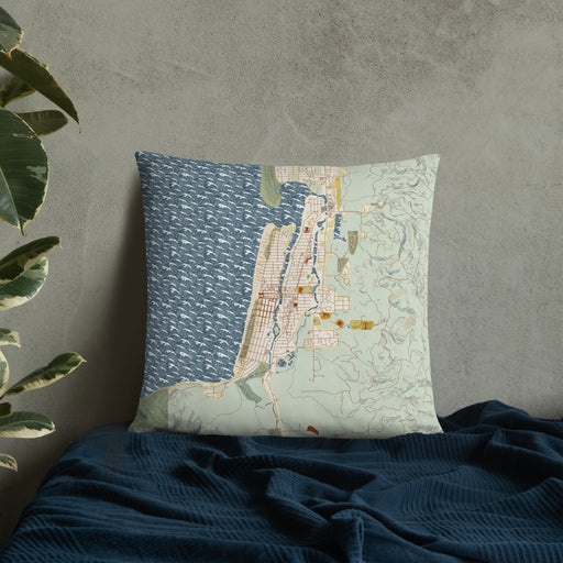 Custom Seaside Oregon Map Throw Pillow in Woodblock on Bedding Against Wall