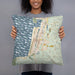 Person holding 18x18 Custom Seaside Oregon Map Throw Pillow in Woodblock