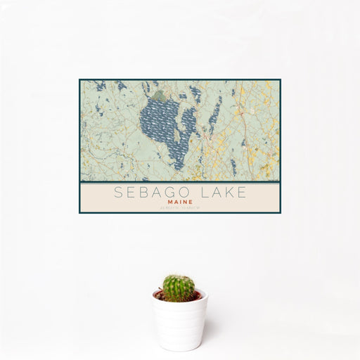 12x18 Sebago Lake Maine Map Print Landscape Orientation in Woodblock Style With Small Cactus Plant in White Planter