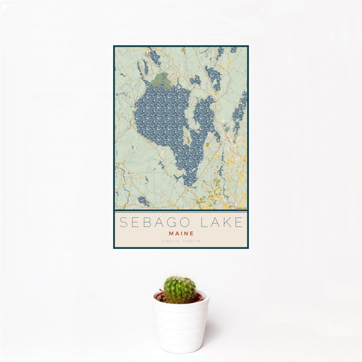 12x18 Sebago Lake Maine Map Print Portrait Orientation in Woodblock Style With Small Cactus Plant in White Planter