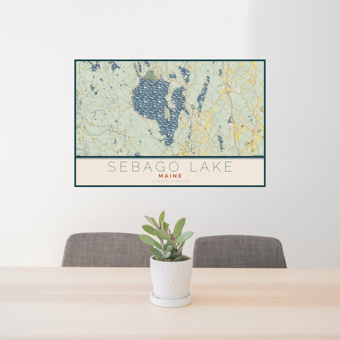 24x36 Sebago Lake Maine Map Print Lanscape Orientation in Woodblock Style Behind 2 Chairs Table and Potted Plant