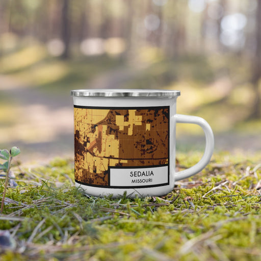 Right View Custom Sedalia Missouri Map Enamel Mug in Ember on Grass With Trees in Background