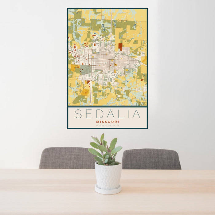 24x36 Sedalia Missouri Map Print Portrait Orientation in Woodblock Style Behind 2 Chairs Table and Potted Plant