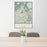 24x36 Sedona Arizona Map Print Portrait Orientation in Woodblock Style Behind 2 Chairs Table and Potted Plant