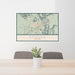 24x36 Sedona Arizona Map Print Landscape Orientation in Woodblock Style Behind 2 Chairs Table and Potted Plant