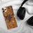 Custom Seneca Falls New York Map Phone Case in Ember on Table with Black Headphones