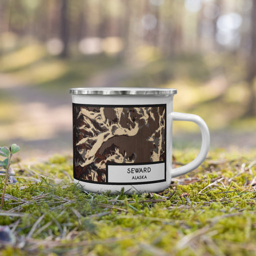 Right View Custom Seward Alaska Map Enamel Mug in Ember on Grass With Trees in Background