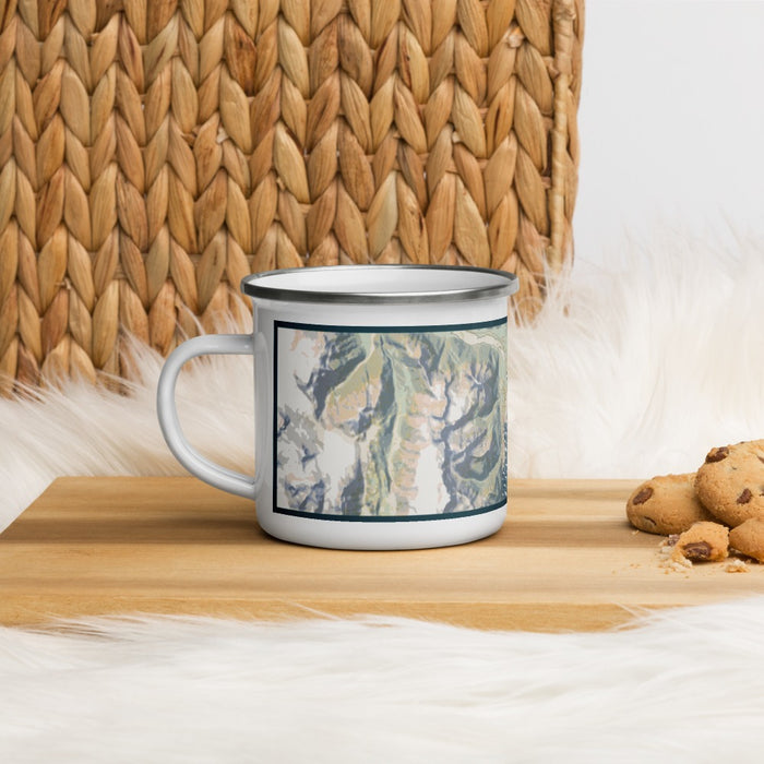 Left View Custom Seward Alaska Map Enamel Mug in Woodblock on Table Top