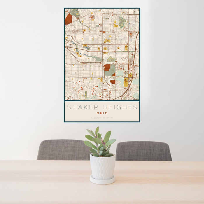 24x36 Shaker Heights Ohio Map Print Portrait Orientation in Woodblock Style Behind 2 Chairs Table and Potted Plant