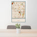 24x36 Shaker Heights Ohio Map Print Portrait Orientation in Woodblock Style Behind 2 Chairs Table and Potted Plant