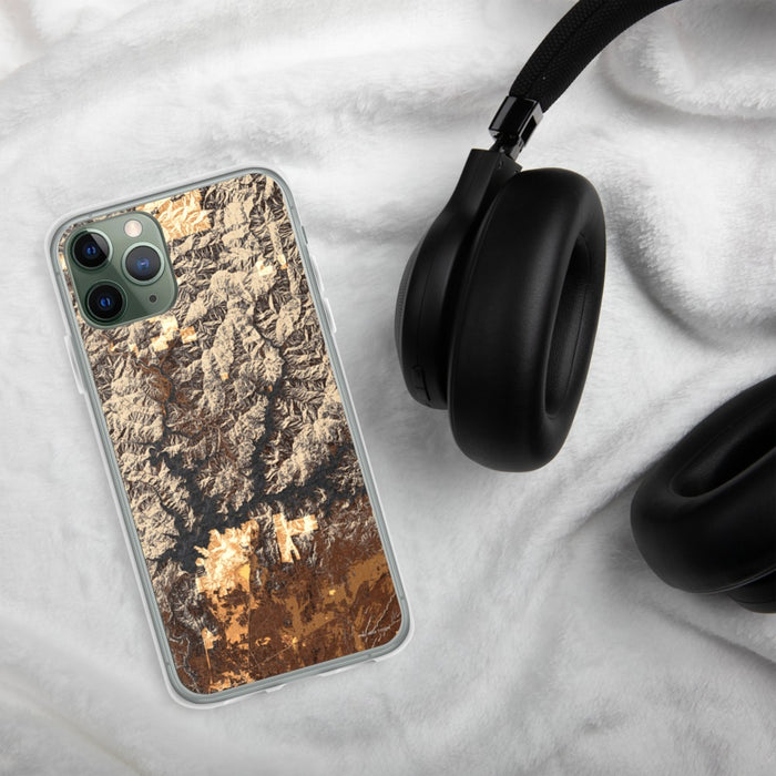 Custom Shasta Lake California Map Phone Case in Ember on Table with Black Headphones