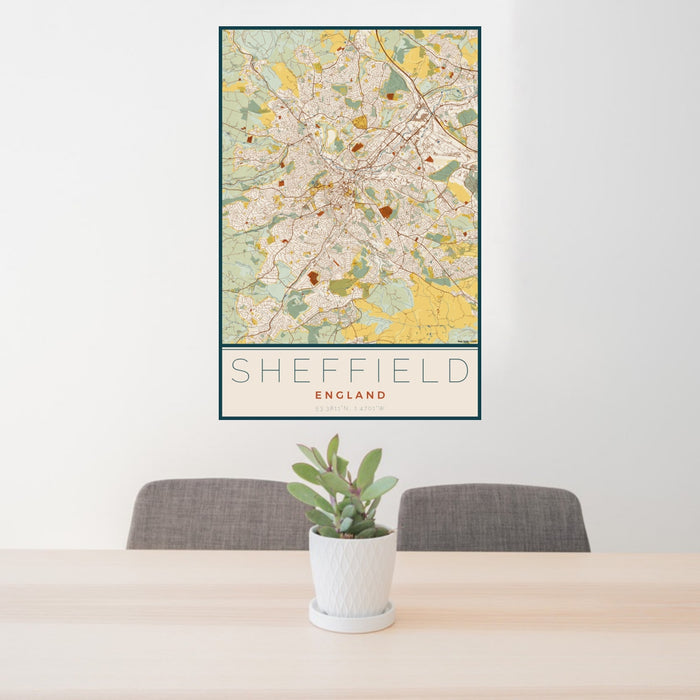 24x36 Sheffield England Map Print Portrait Orientation in Woodblock Style Behind 2 Chairs Table and Potted Plant