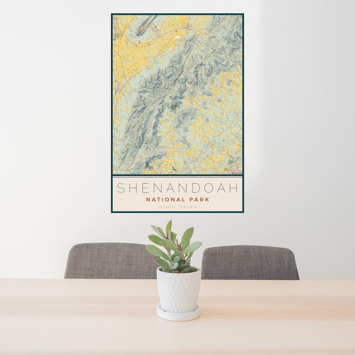 24x36 Shenandoah National Park Map Print Portrait Orientation in Woodblock Style Behind 2 Chairs Table and Potted Plant