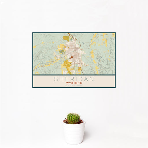 12x18 Sheridan Wyoming Map Print Landscape Orientation in Woodblock Style With Small Cactus Plant in White Planter