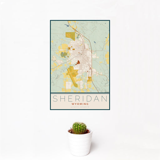 12x18 Sheridan Wyoming Map Print Portrait Orientation in Woodblock Style With Small Cactus Plant in White Planter