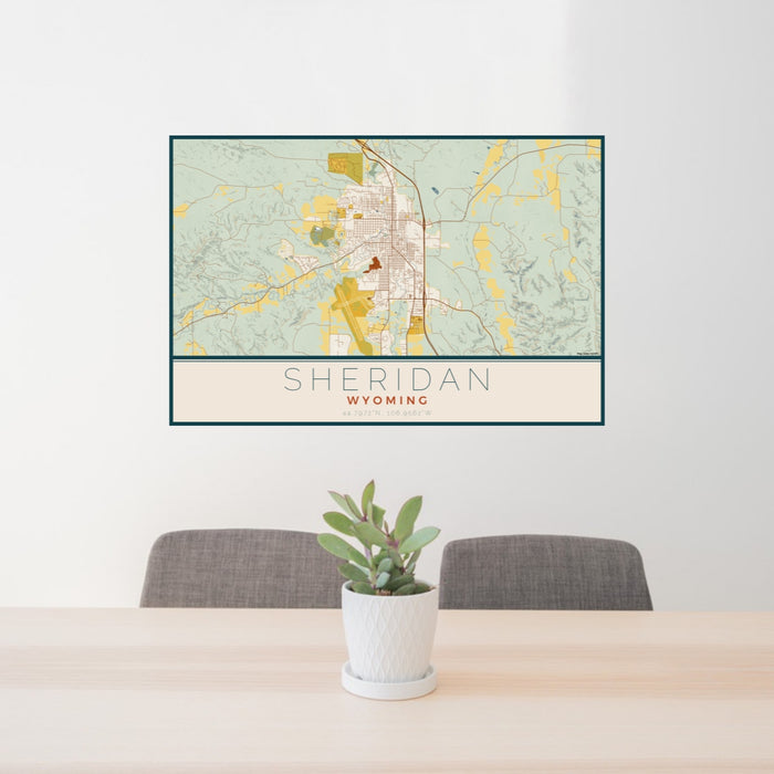 24x36 Sheridan Wyoming Map Print Lanscape Orientation in Woodblock Style Behind 2 Chairs Table and Potted Plant