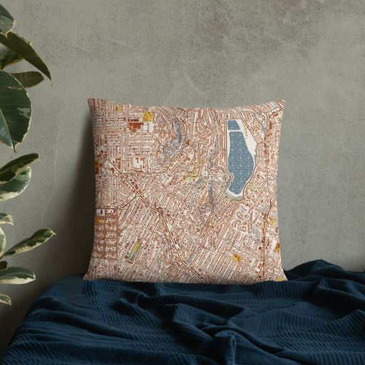 Custom Silver Lake Los Angeles Map Throw Pillow in Woodblock on Bedding Against Wall
