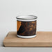 Front View Custom Silver Lake Michigan Map Enamel Mug in Ember on Cutting Board
