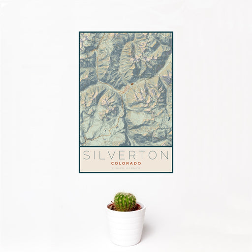 12x18 Silverton Colorado Map Print Portrait Orientation in Woodblock Style With Small Cactus Plant in White Planter