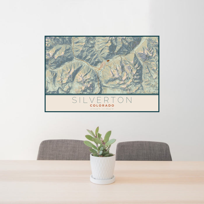 24x36 Silverton Colorado Map Print Lanscape Orientation in Woodblock Style Behind 2 Chairs Table and Potted Plant