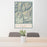 24x36 Silverton Colorado Map Print Portrait Orientation in Woodblock Style Behind 2 Chairs Table and Potted Plant