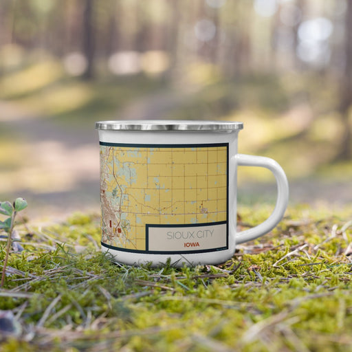 Right View Custom Sioux City Iowa Map Enamel Mug in Woodblock on Grass With Trees in Background