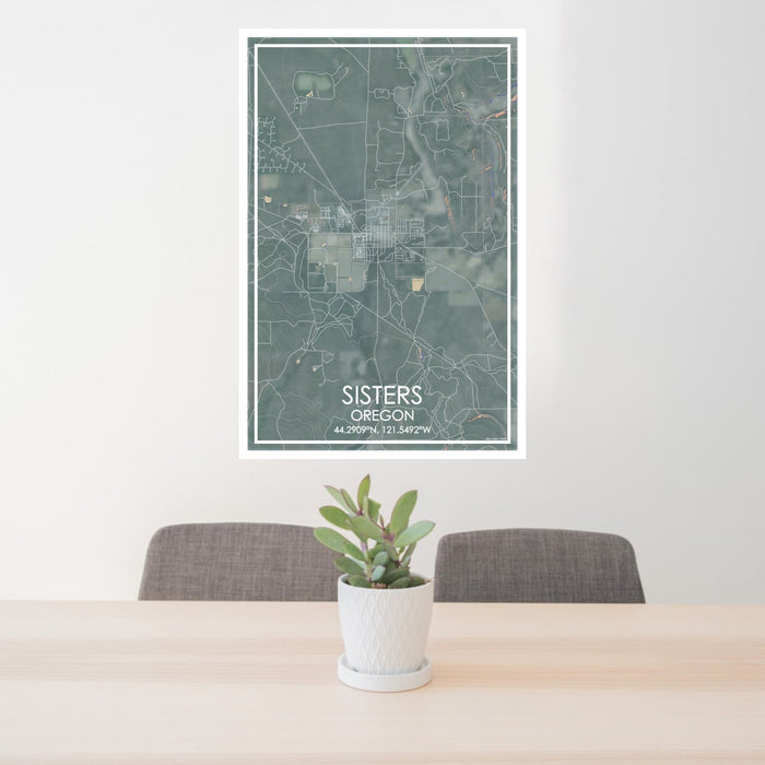 24x36 Sisters Oregon Map Print Portrait Orientation in Afternoon Style Behind 2 Chairs Table and Potted Plant