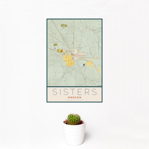 12x18 Sisters Oregon Map Print Portrait Orientation in Woodblock Style With Small Cactus Plant in White Planter
