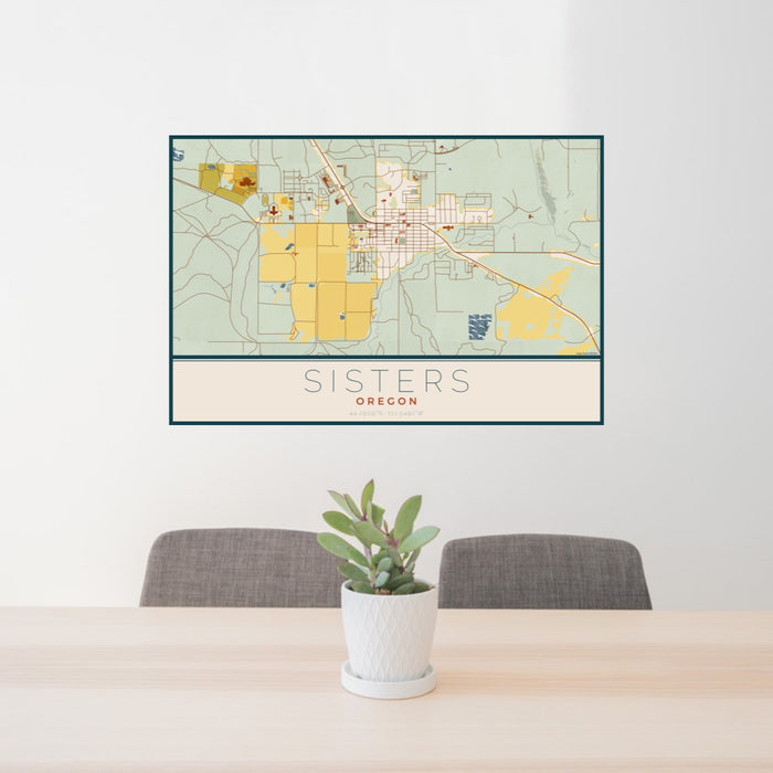 24x36 Sisters Oregon Map Print Landscape Orientation in Woodblock Style Behind 2 Chairs Table and Potted Plant