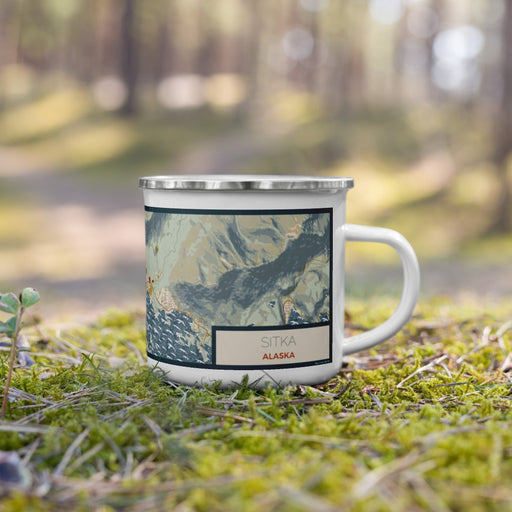 Right View Custom Sitka Alaska Map Enamel Mug in Woodblock on Grass With Trees in Background