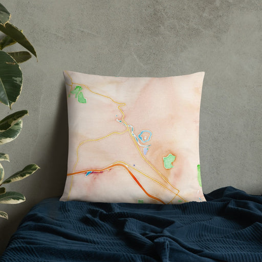 Custom Snoqualmie Washington Map Throw Pillow in Watercolor on Bedding Against Wall