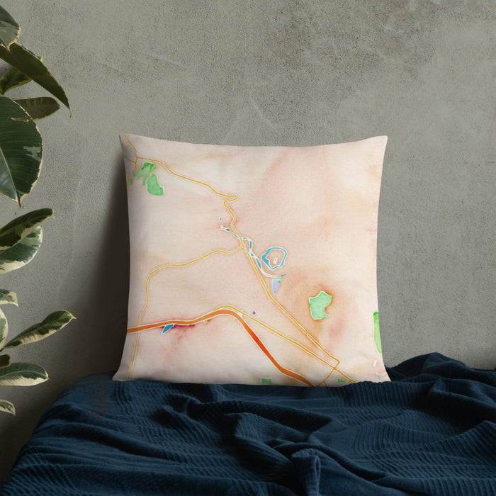 Custom Snoqualmie Washington Map Throw Pillow in Watercolor on Bedding Against Wall
